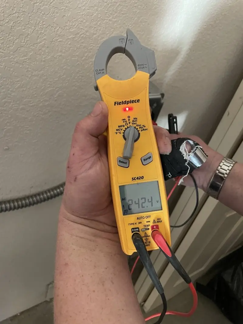 Voltage testing with clamp meter during Generator Installation in Huber Ridge